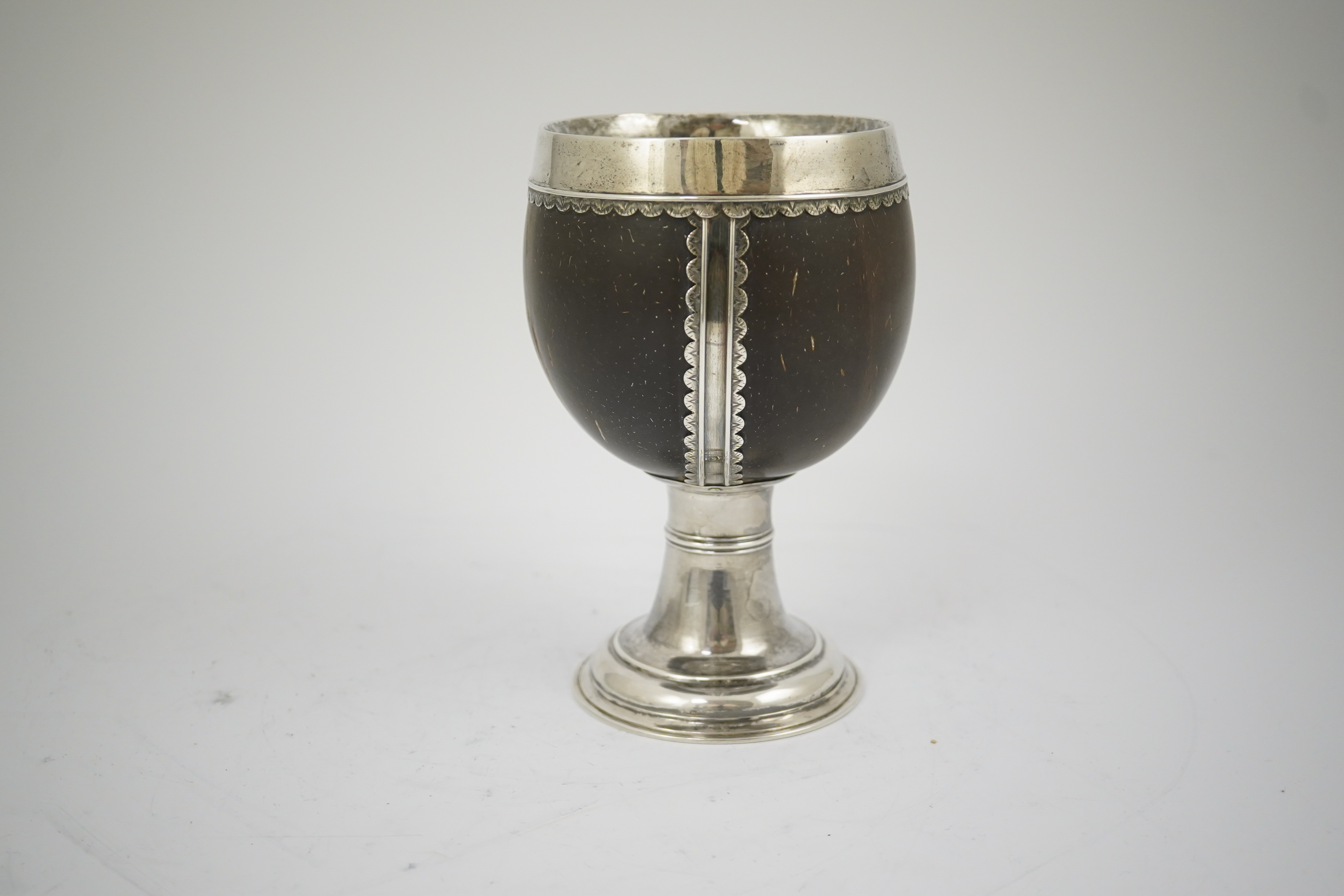 A late George I? silver mounted coconut cup, makers mark only, possible Samuel Eaton, London